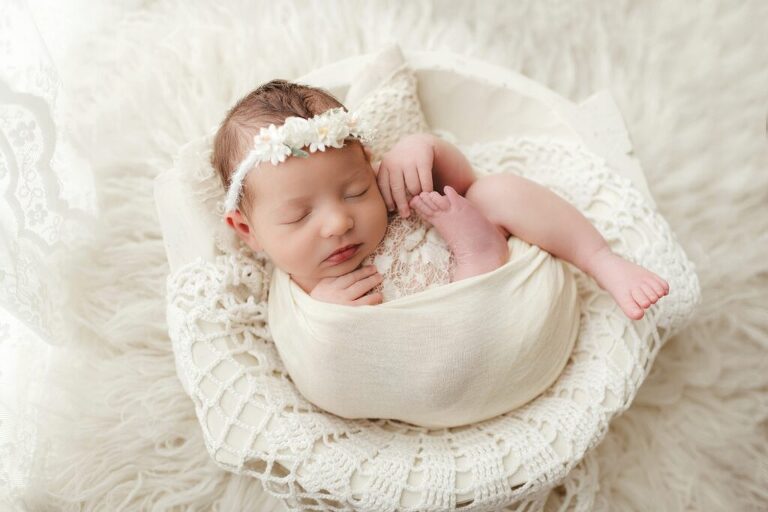 Studio newborn portrait of baby girl sleeping