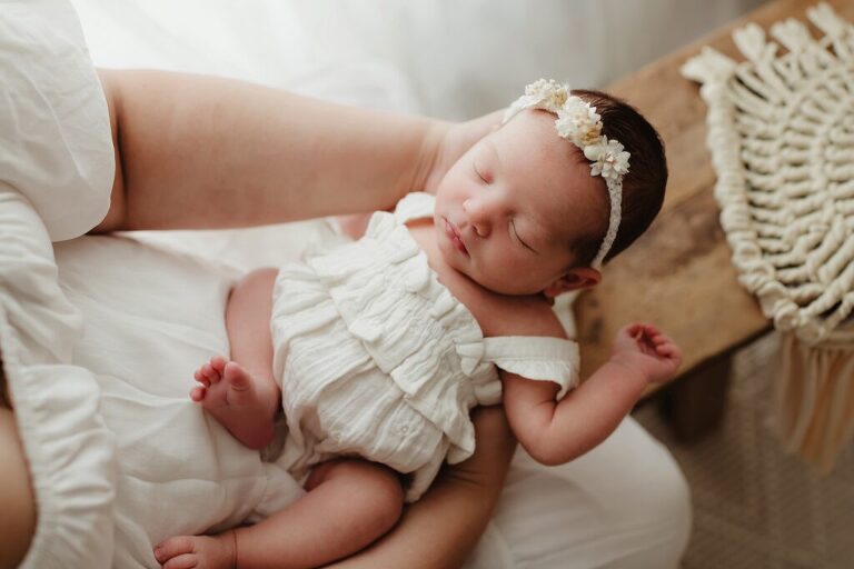 Baby girl in Mama's arms in Lake County, IL Photography studio