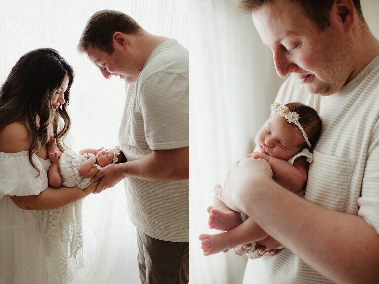 Parents holding baby girl during newborn session