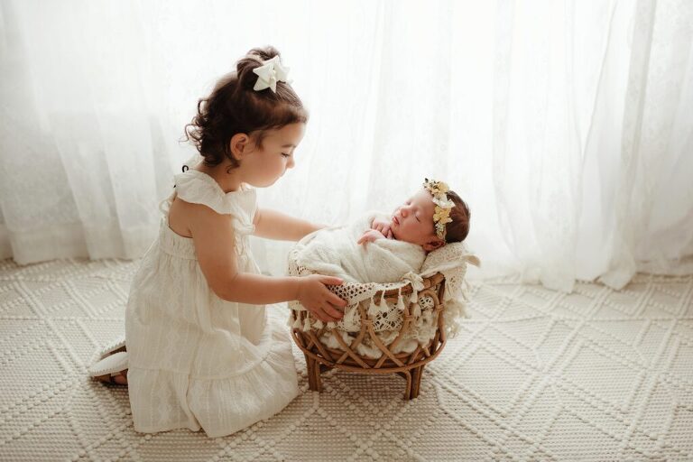 Sweet sibling moment during newborn session